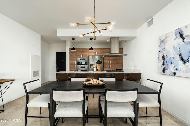 dining area featuring a notable chandelier