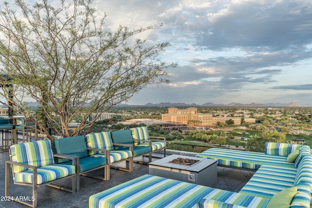 view of patio / terrace featuring an outdoor living space with a fire pit