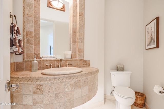 bathroom with toilet and sink