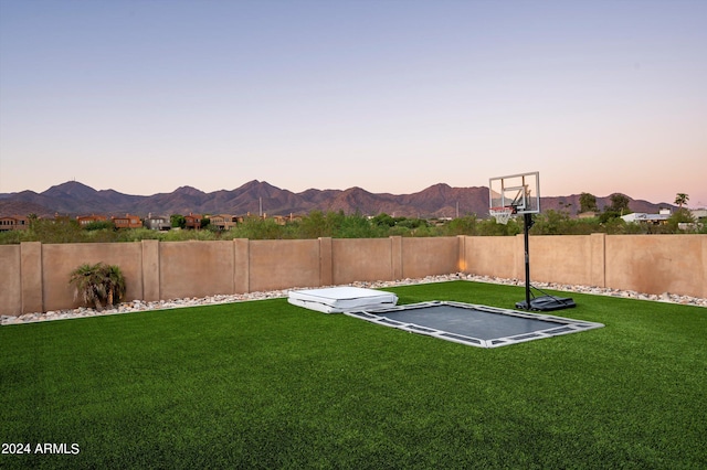 exterior space with a mountain view and a yard