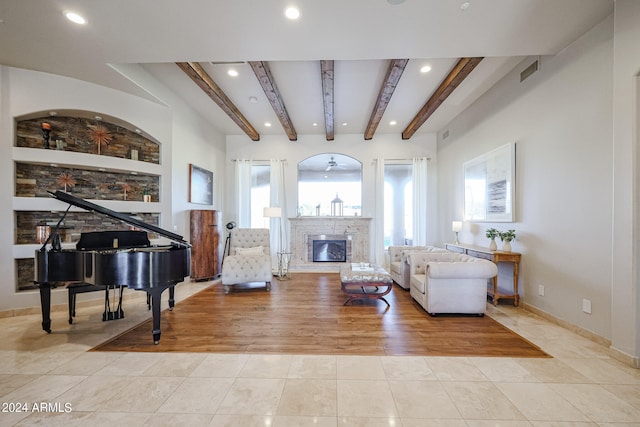 living room with light hardwood / wood-style flooring and beam ceiling