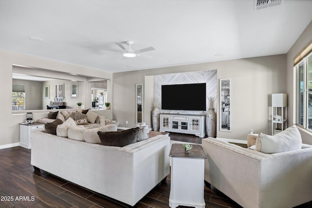 21328 E Misty Ln, Queen Creek, AZ 85142 - living area featuring visible vents, ceiling fan, baseboards, and dark wood-style floors