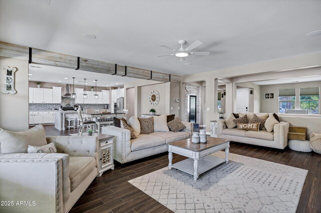 21328 E Misty Ln, Queen Creek, AZ 85142 - living room with dark wood-style floors and a ceiling fan