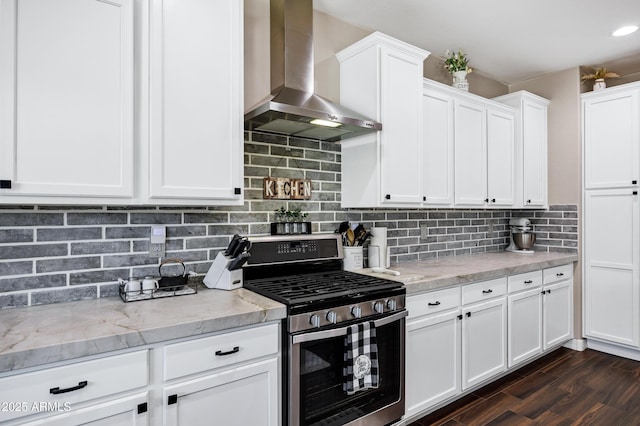 21328 E Misty Ln, Queen Creek, AZ 85142 - kitchen with white cabinets, wall chimney range hood, stainless steel range with gas cooktop, light stone countertops, and backsplash