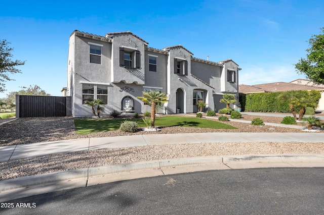 21328 E Misty Ln, Queen Creek, AZ 85142 - mediterranean / spanish-style house with stucco siding, a tile roof, and a gate