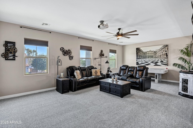 21328 E Misty Ln, Queen Creek, AZ 85142 - carpeted living area with baseboards, visible vents, and a wealth of natural light