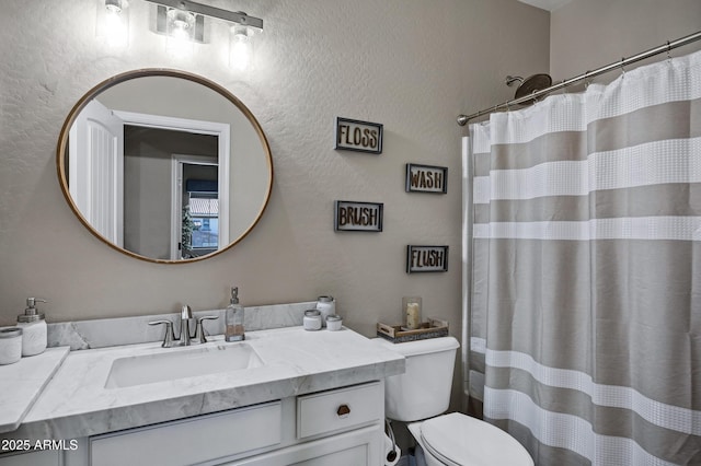 21328 E Misty Ln, Queen Creek, AZ 85142 - bathroom with toilet, curtained shower, vanity, and a textured wall
