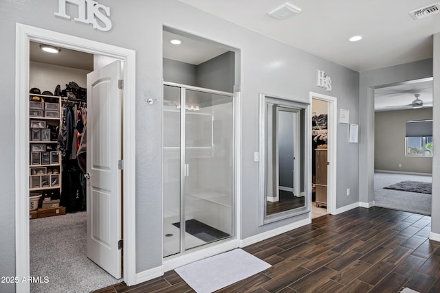 21328 E Misty Ln, Queen Creek, AZ 85142 - full bath featuring baseboards, a stall shower, a ceiling fan, visible vents, and wood finished floors
