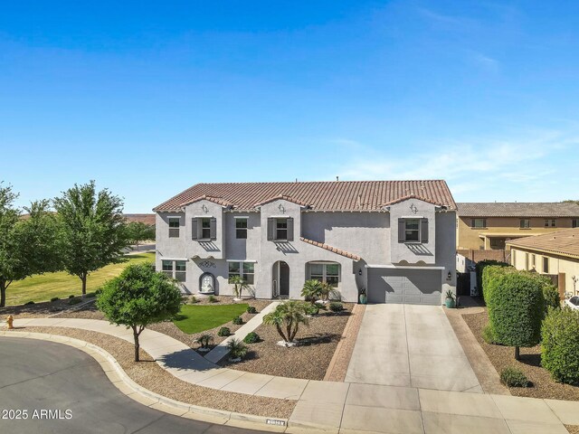 21328 E Misty Ln, Queen Creek, AZ 85142 - mediterranean / spanish house featuring driveway, a tile roof, a garage, and stucco siding