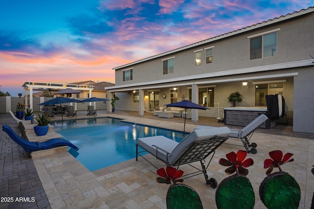 21328 E Misty Ln, Queen Creek, AZ 85142 - pool at dusk featuring a fenced in pool, a water slide, a patio area, an outdoor hangout area, and fence