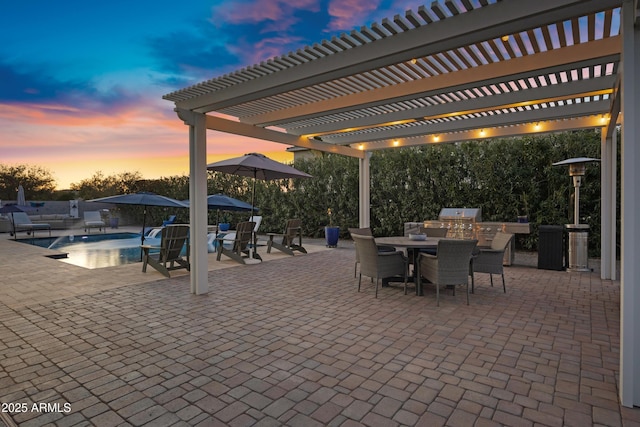 21328 E Misty Ln, Queen Creek, AZ 85142 - patio terrace at dusk with area for grilling, an outdoor pool, outdoor dining space, and a pergola
