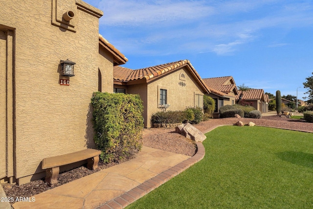 view of home's exterior with a yard