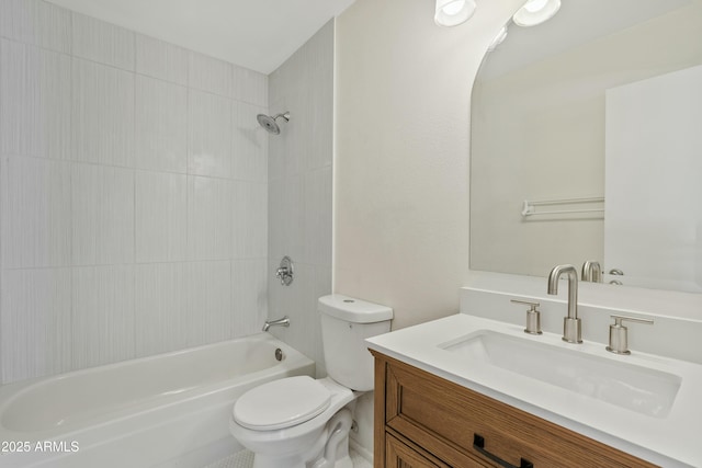bathroom featuring toilet, vanity, and  shower combination