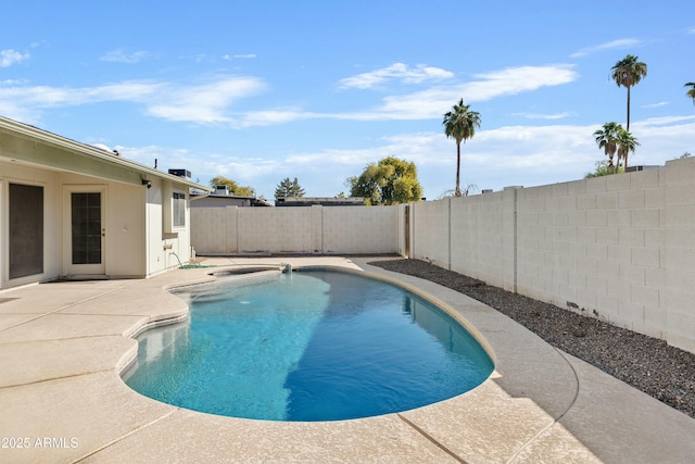 view of pool with a fenced backyard, a fenced in pool, and a patio area
