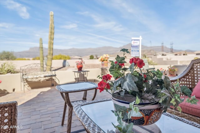 view of patio / terrace featuring a mountain view