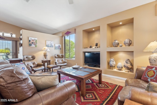 living area featuring built in shelves