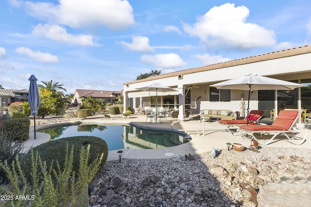 back of house with a patio area