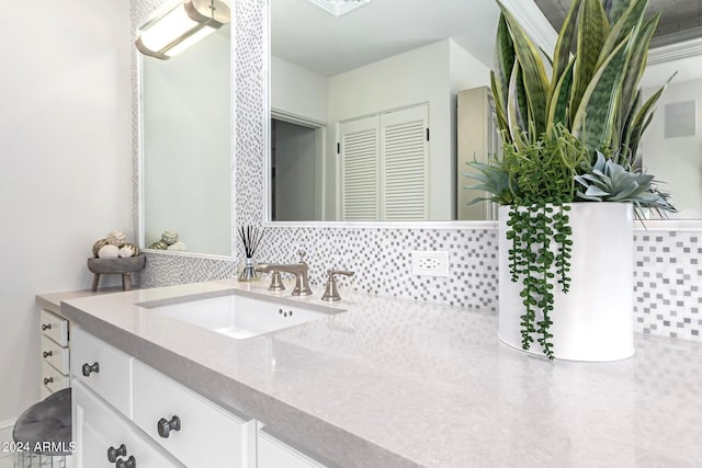 bathroom with backsplash and vanity