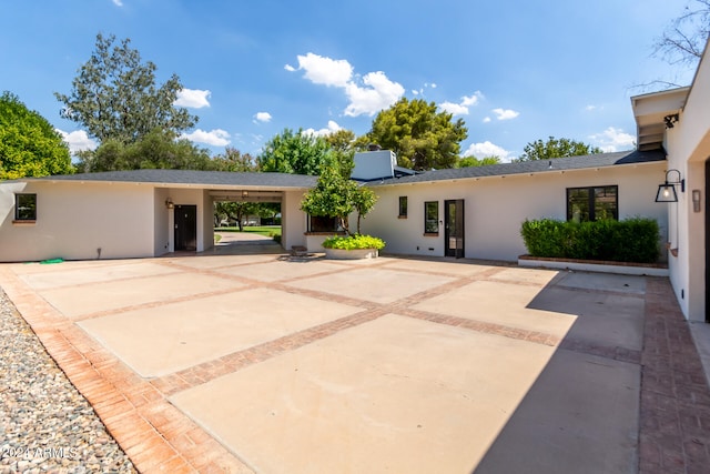 back of property with a patio area