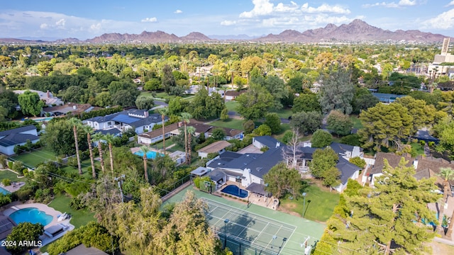 birds eye view of property with a mountain view