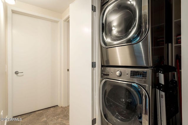 washroom with stacked washer / dryer