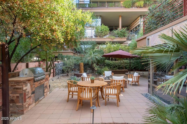 view of patio with an outdoor kitchen and area for grilling