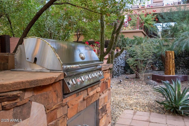 view of patio featuring grilling area and exterior kitchen