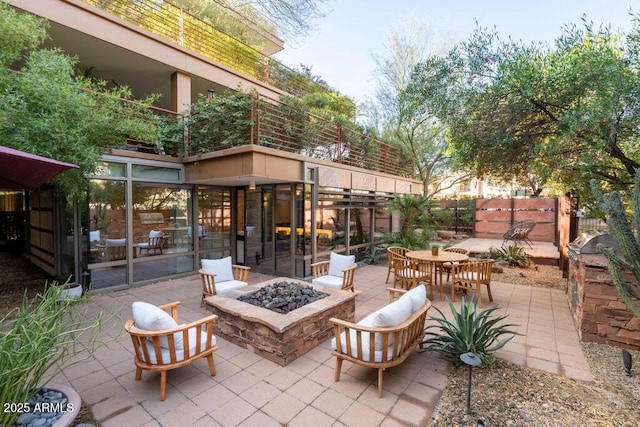 view of patio with an outdoor fire pit