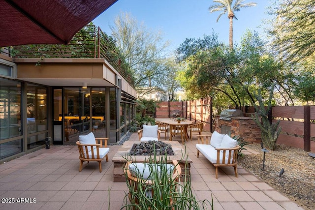 view of patio with area for grilling, an outdoor hangout area, and grilling area