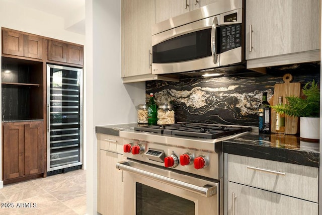 kitchen with appliances with stainless steel finishes, beverage cooler, and decorative backsplash