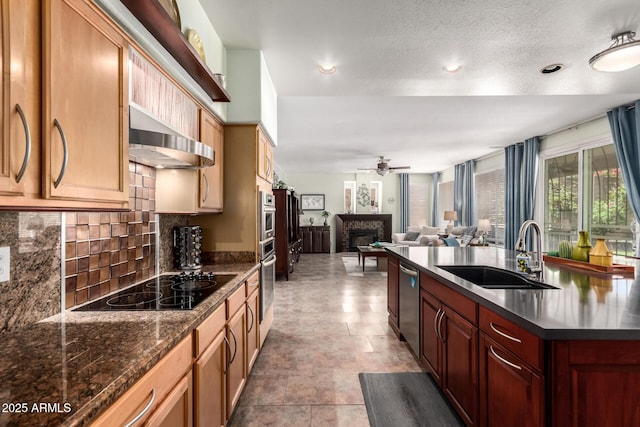 818 E Hiddenview Dr, Phoenix, AZ 85048 - kitchen with a sink, black electric stovetop, stainless steel dishwasher, ceiling fan, and a fireplace