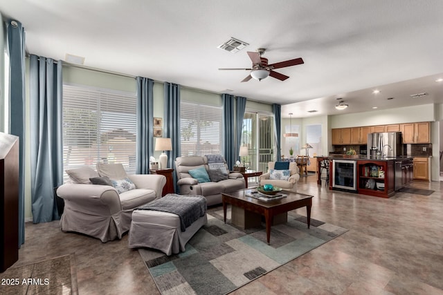 818 E Hiddenview Dr, Phoenix, AZ 85048 - living room featuring beverage cooler and ceiling fan