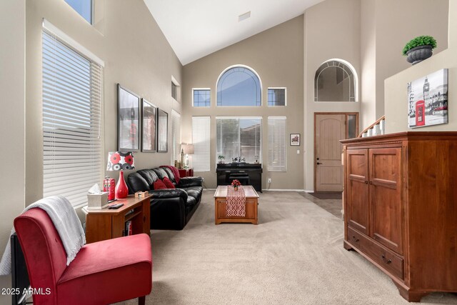 818 E Hiddenview Dr, Phoenix, AZ 85048 - living area featuring high vaulted ceiling, light colored carpet, and baseboards