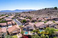 818 E Hiddenview Dr, Phoenix, AZ 85048 - aerial perspective of suburban area featuring a mountainous background