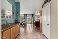 818 E Hiddenview Dr, Phoenix, AZ 85048 - kitchen with dark countertops