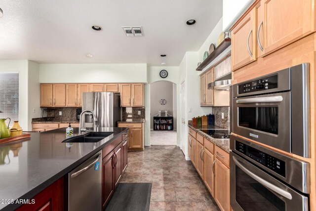 818 E Hiddenview Dr, Phoenix, AZ 85048 - kitchen featuring a sink, appliances with stainless steel finishes, dark countertops, exhaust hood, and backsplash