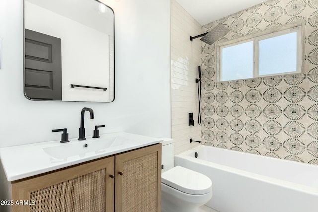 full bath with vanity, toilet, and shower / washtub combination