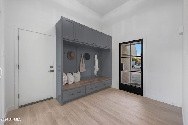 mudroom with light hardwood / wood-style flooring