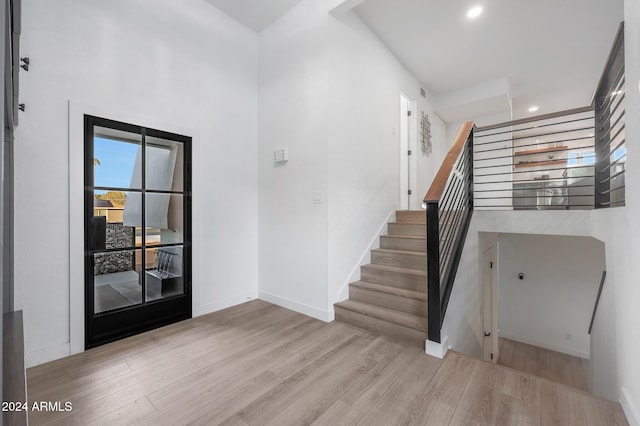 entryway with light hardwood / wood-style flooring