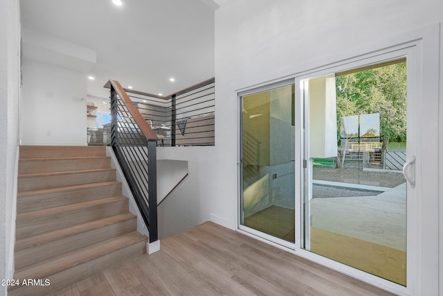 staircase featuring hardwood / wood-style flooring