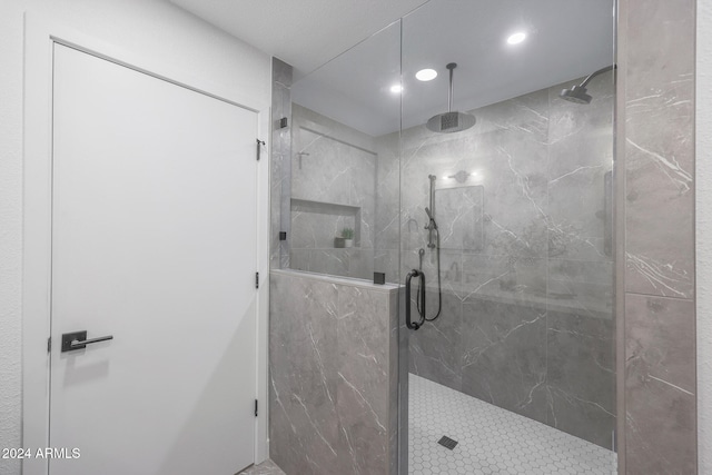 bathroom with a tile shower