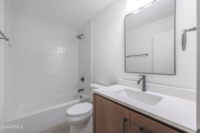 full bathroom with toilet, vanity, and tiled shower / bath