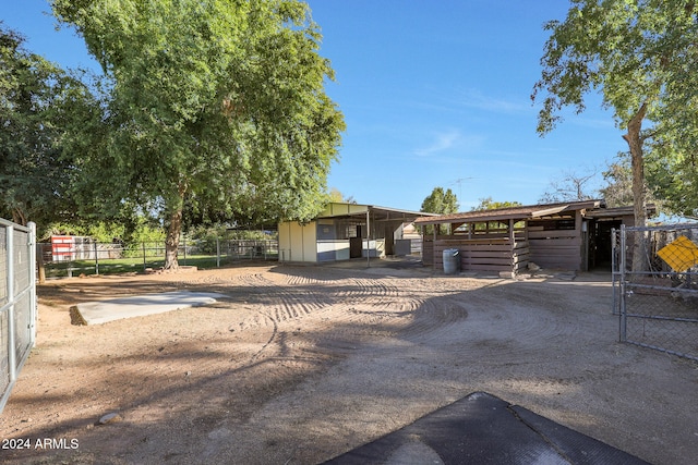 view of front of house featuring an outbuilding