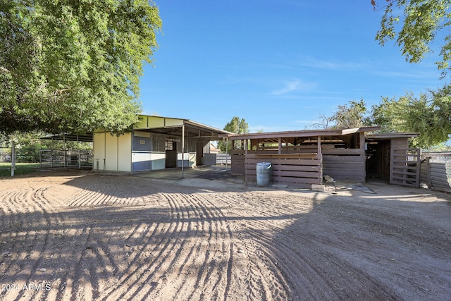 view of front of property featuring an outbuilding