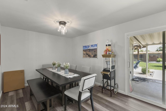 dining area with hardwood / wood-style flooring