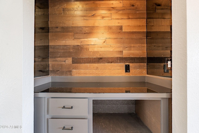 sauna featuring wood walls