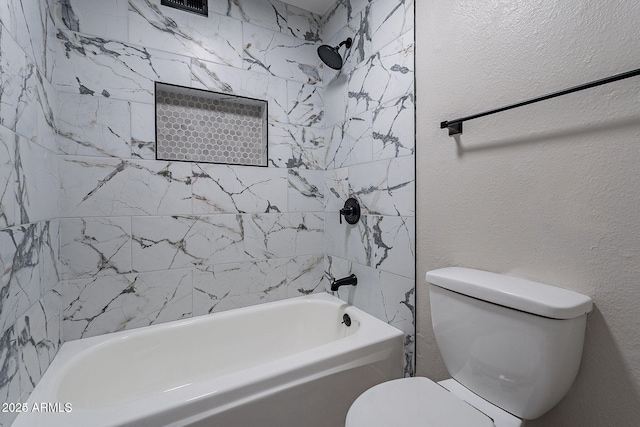 bathroom featuring toilet and tub / shower combination