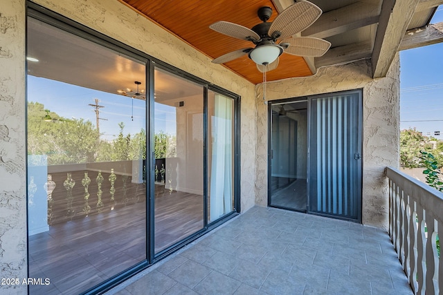 balcony featuring ceiling fan