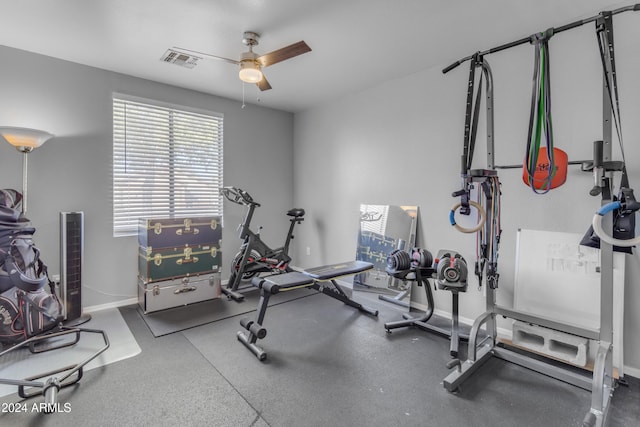 exercise room with ceiling fan