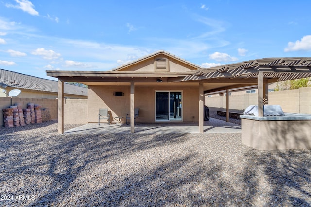 back of property featuring a patio